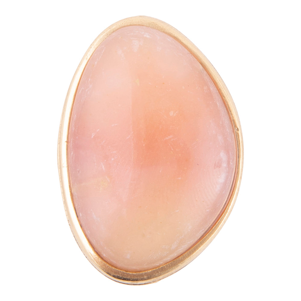 A rose quartz gemstone ring with a polished gold bezel setting, shown against a plain white background.