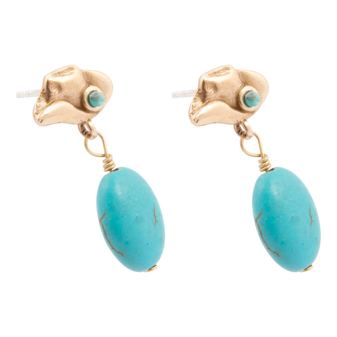 Gold earrings with turquoise stones on a white background