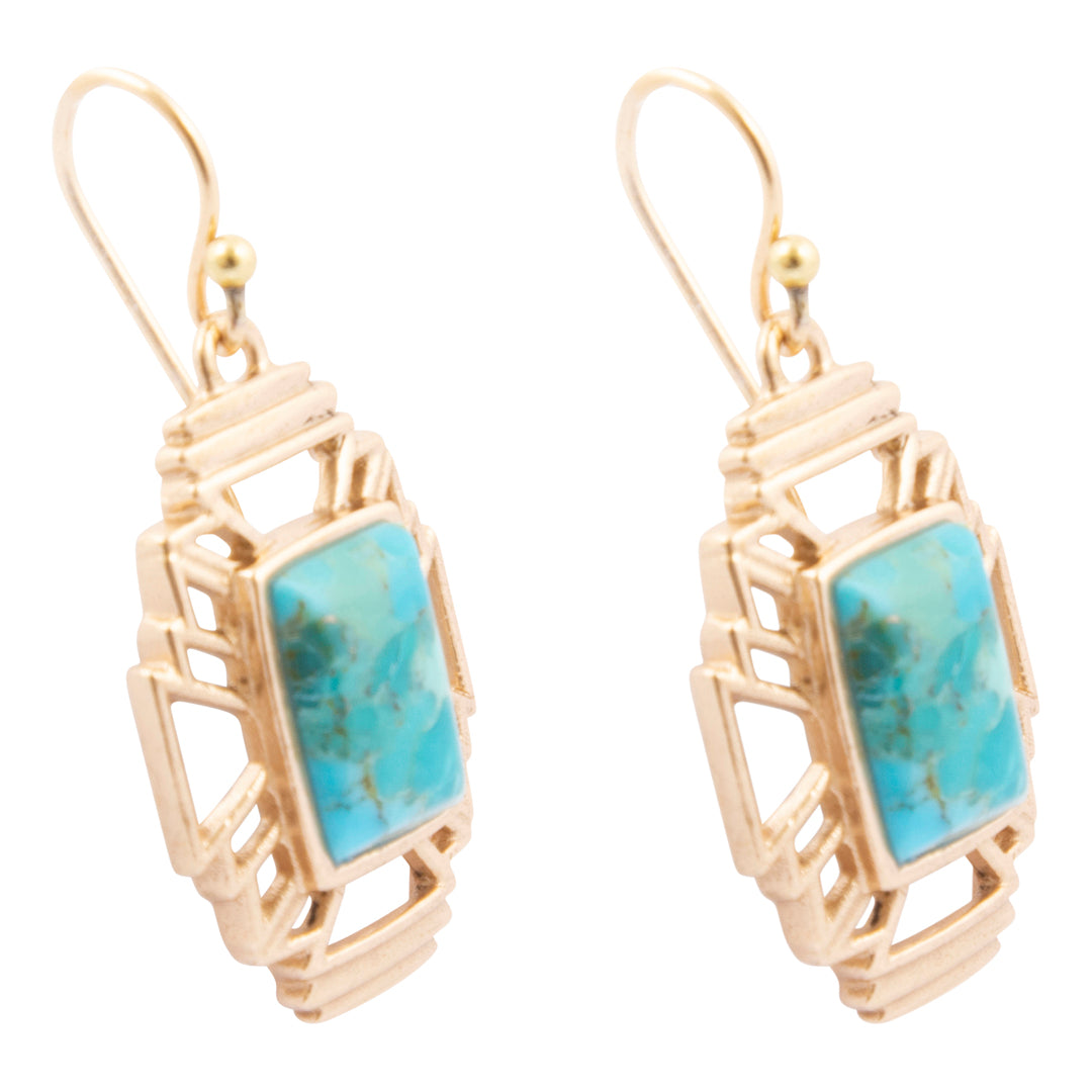 Gold-framed earrings with turquoise stones on a white background