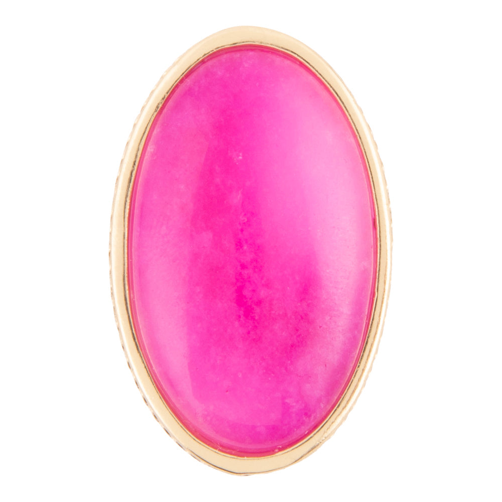 An oval-shaped pink cabochon stone set in a gold-tone bezel, shown against a plain white background.