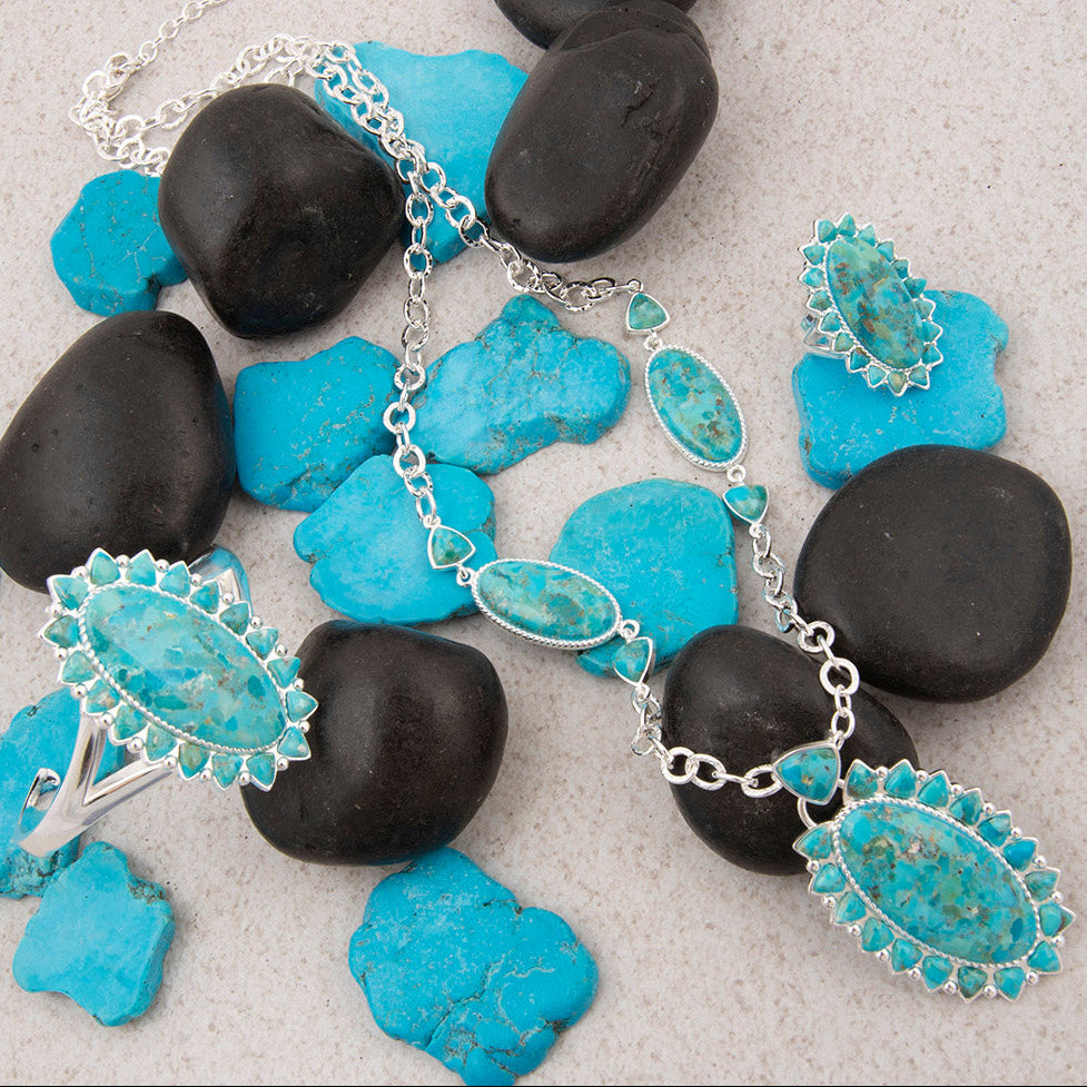 Necklace with turquoise stones on a background of black and blue stones