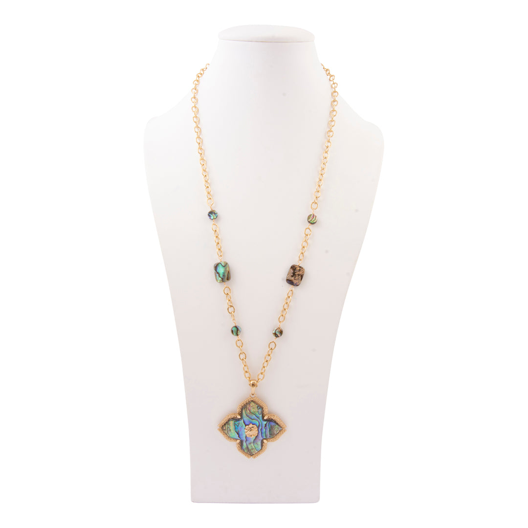 Necklace with a decorative pendant on a white mannequin bust