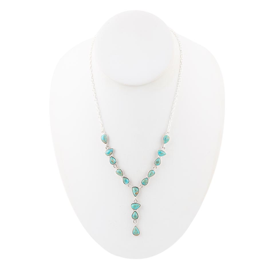 Turquoise necklace on a white mannequin bust