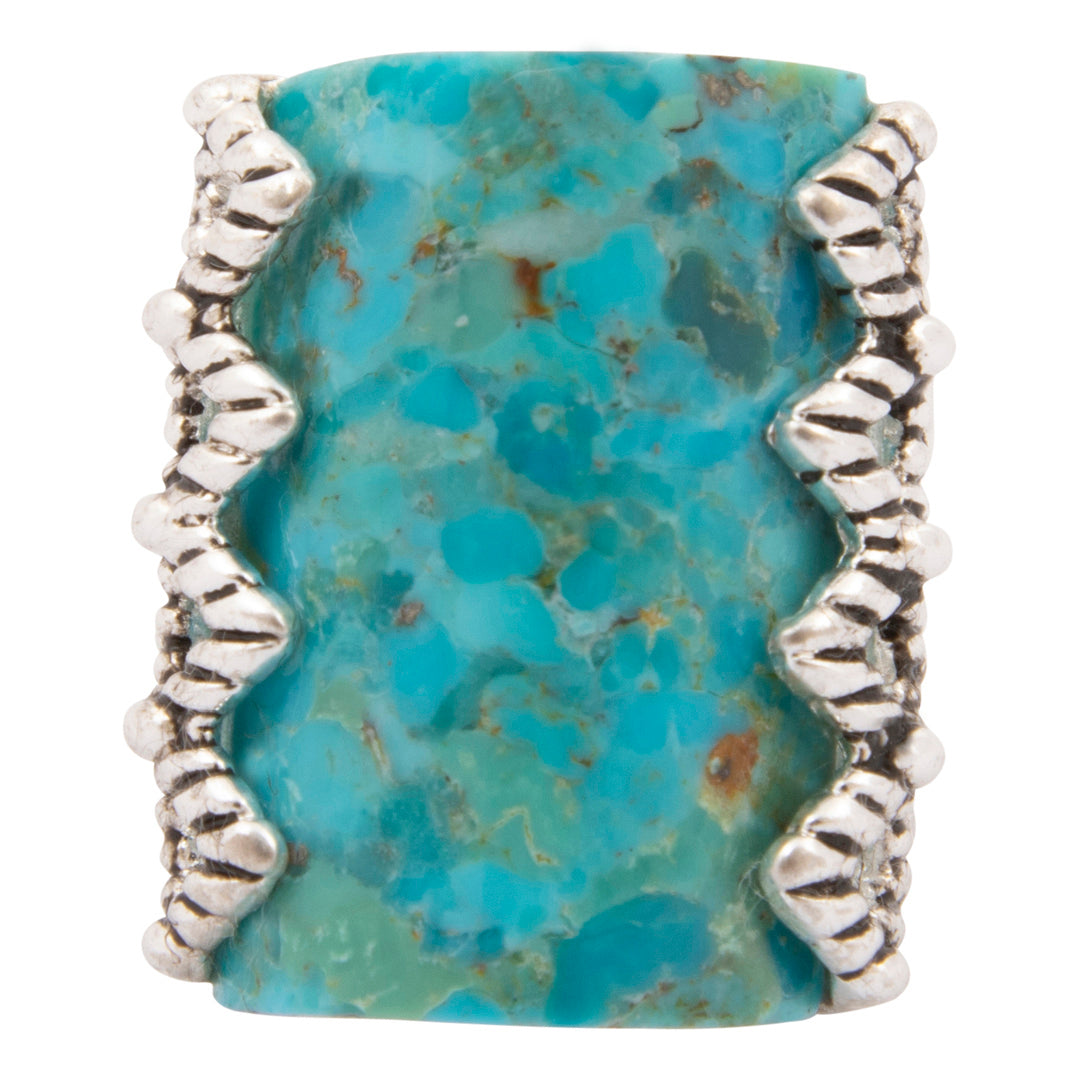 Turquoise stone ring with silver band on a white background