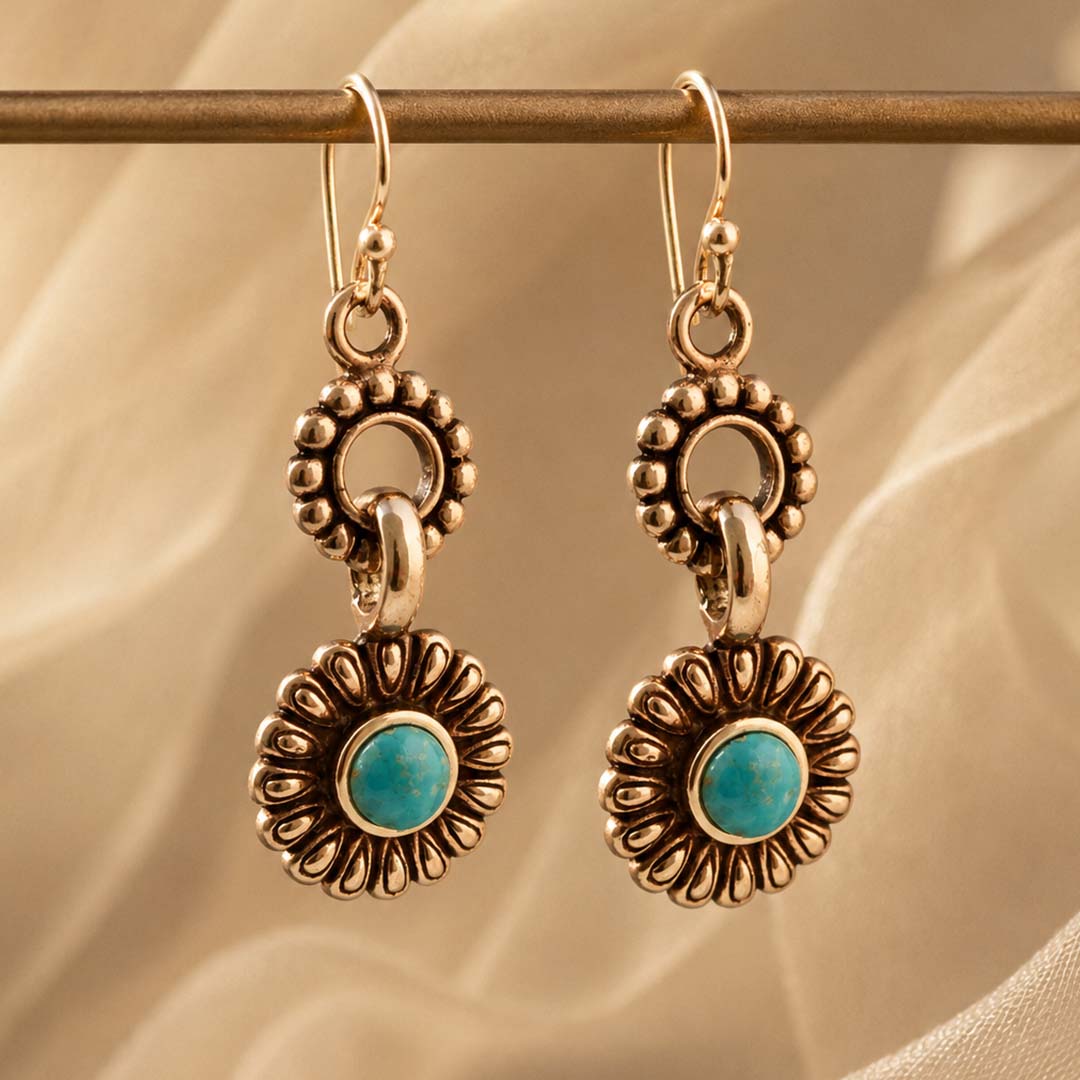 Agave turquoise bronze earrings against a warm lifestyle background