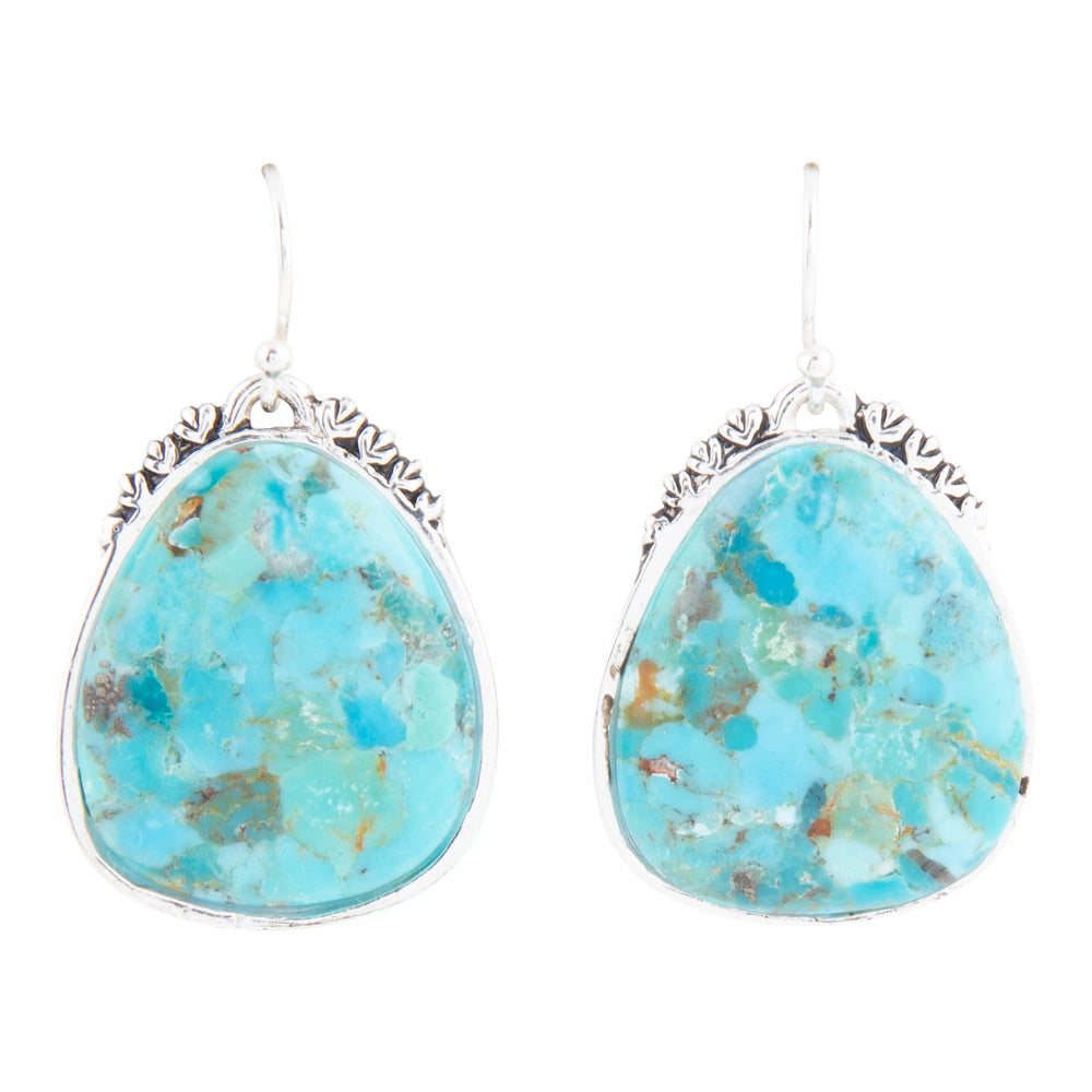 Turquoise stone earrings with silver frames on a white background