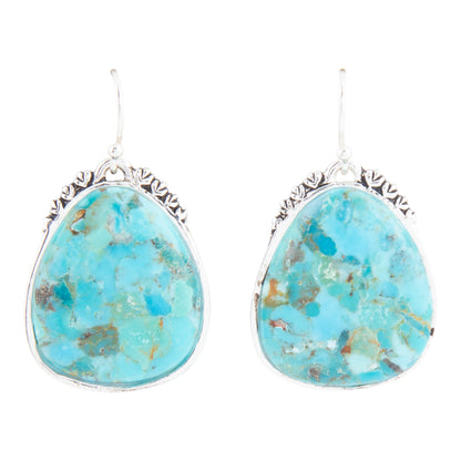 Turquoise stone earrings with silver frames on a white background