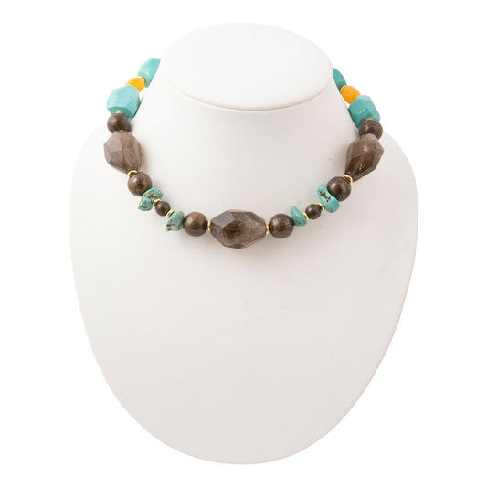 Barse Earthbound smoky quartz, magnesite, yellow jasper and bronzite statement necklace on a white jewelry bust