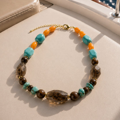 Barse Earthbound smoky quartz mixed-stone statement necklace on a styled background