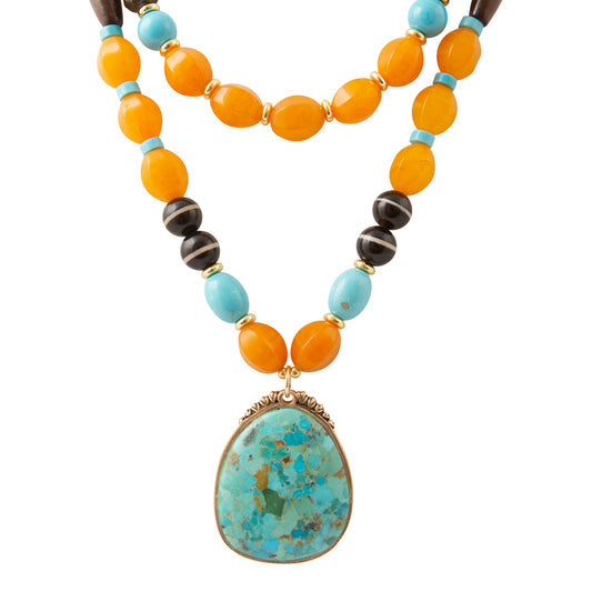 Close-up of the turquoise pendant and mixed-stone beads in the Barse Earthbound layered necklace