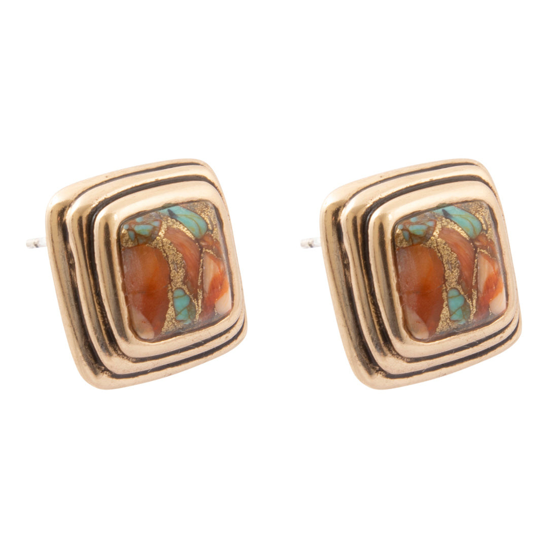 A pair of gold square stud earrings with concentric layered borders and a central inlay featuring orange-brown stone and turquoise accents, shown on a plain white background.