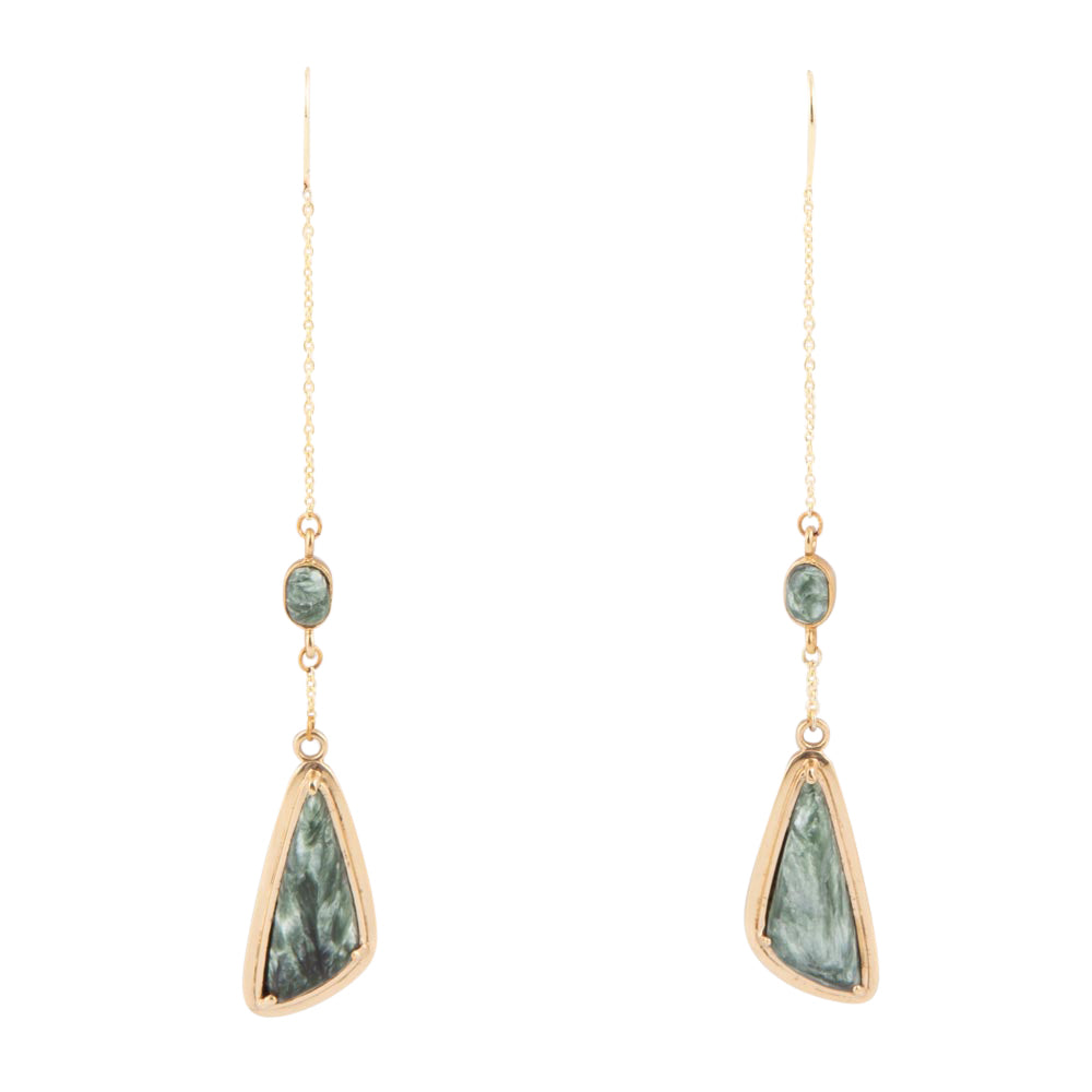 A pair of long drop earrings with gold-toned chains, small oval green stones, and larger irregular green stone pendants in gold-toned bezel settings, shown on a plain white background.