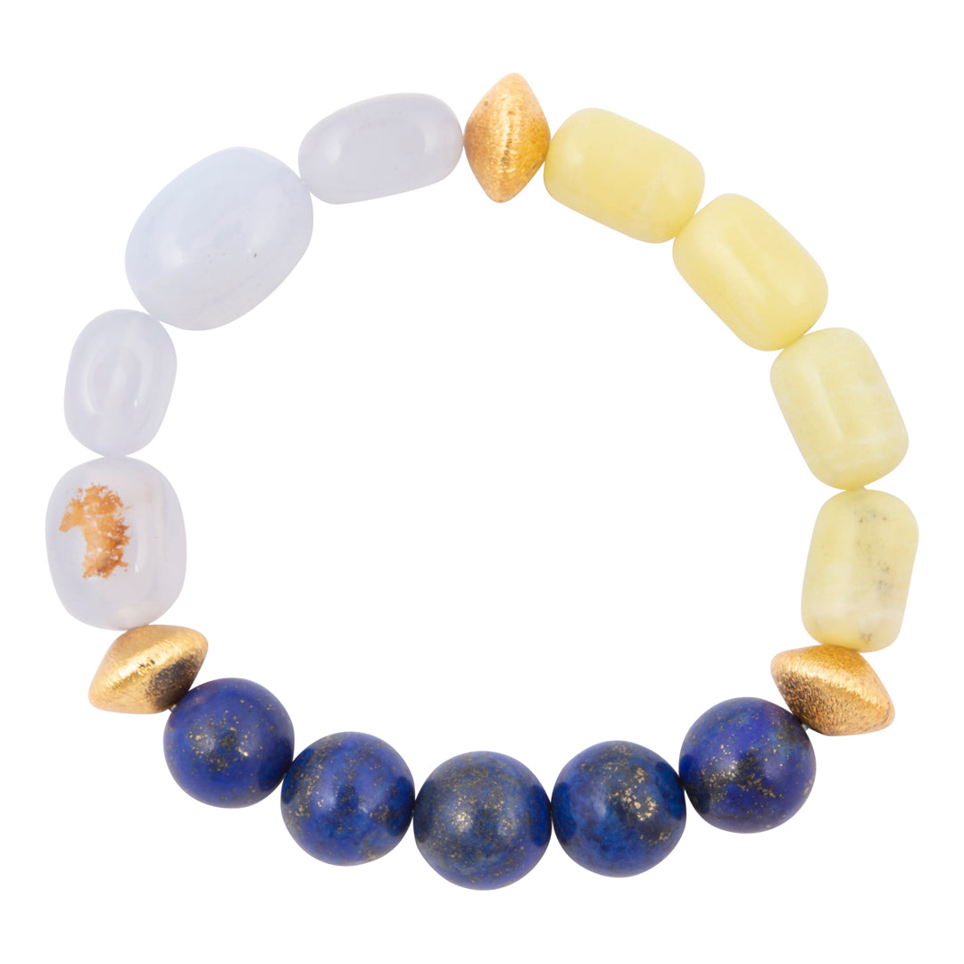 Multicolored beaded bracelet with white, yellow, and blue beads on a white background