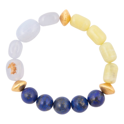Multicolored beaded bracelet with white, yellow, and blue beads on a white background