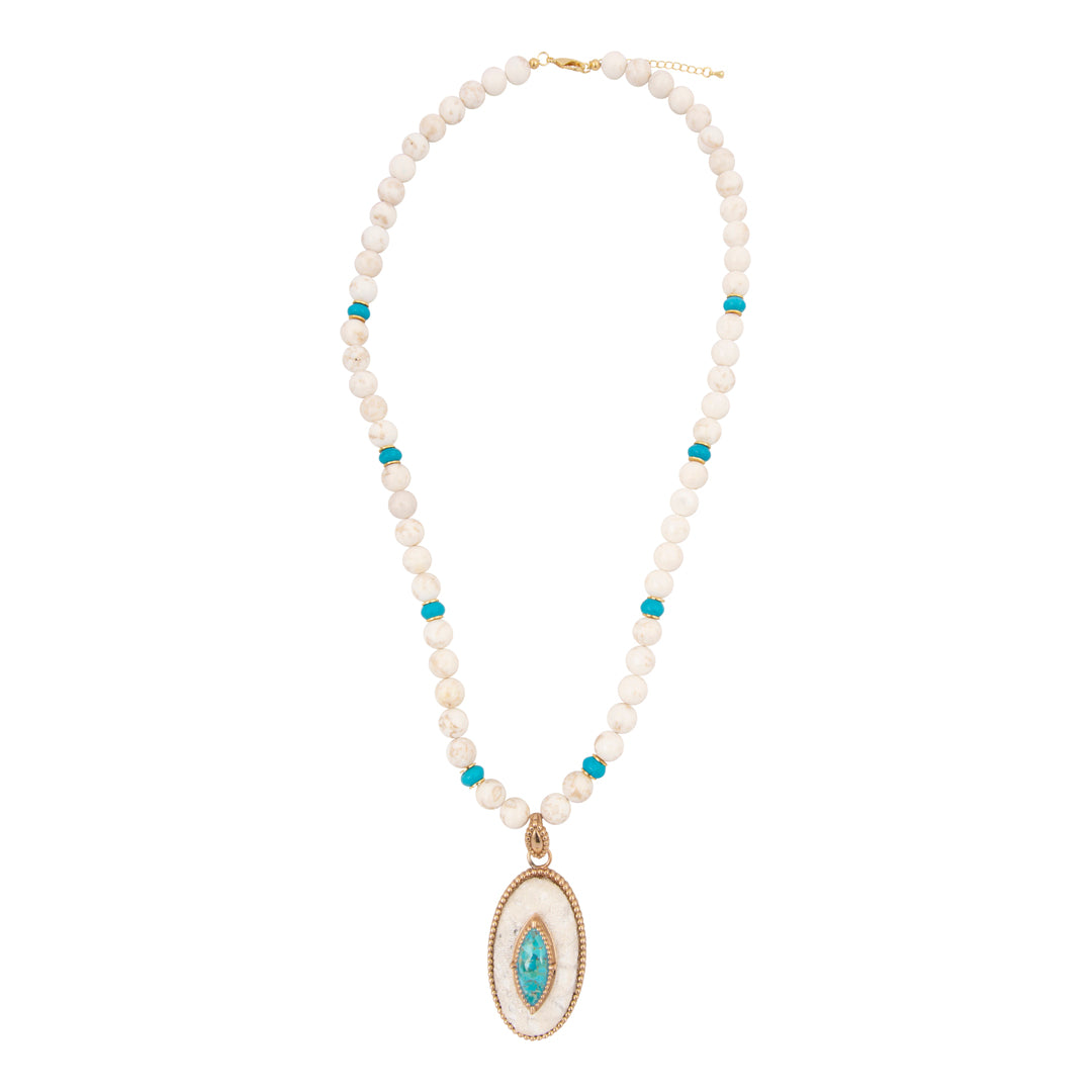 Necklace with white beads and a turquoise pendant on a white background