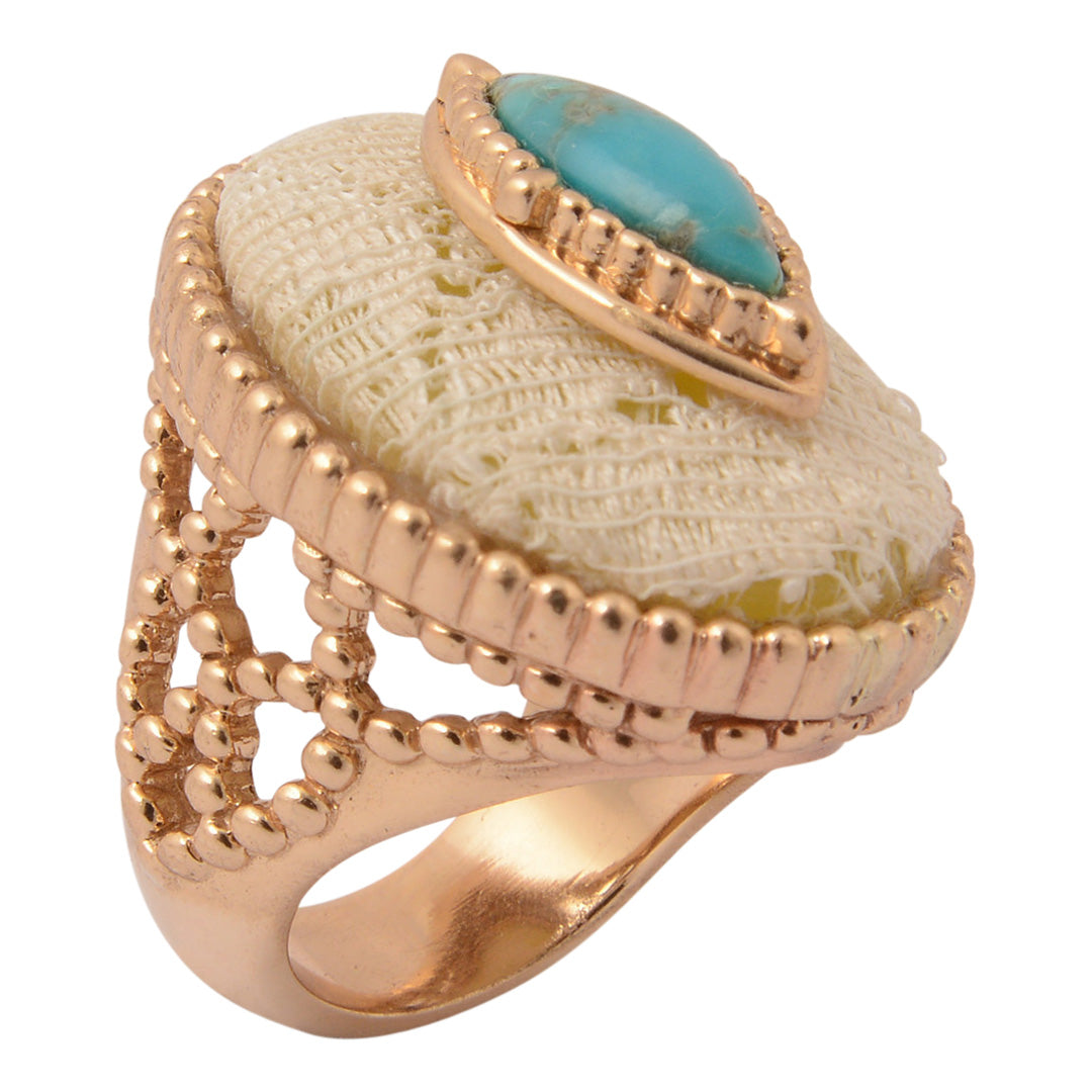 Gold ring with turquoise stone on a white background