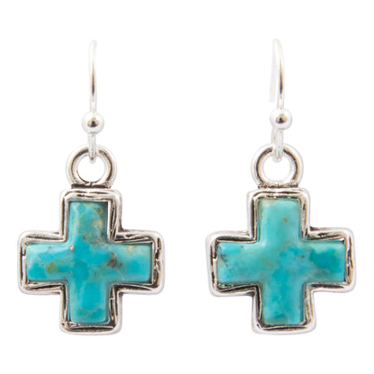 A pair of silver cross dangle earrings with turquoise inlay, shown against a plain white background.