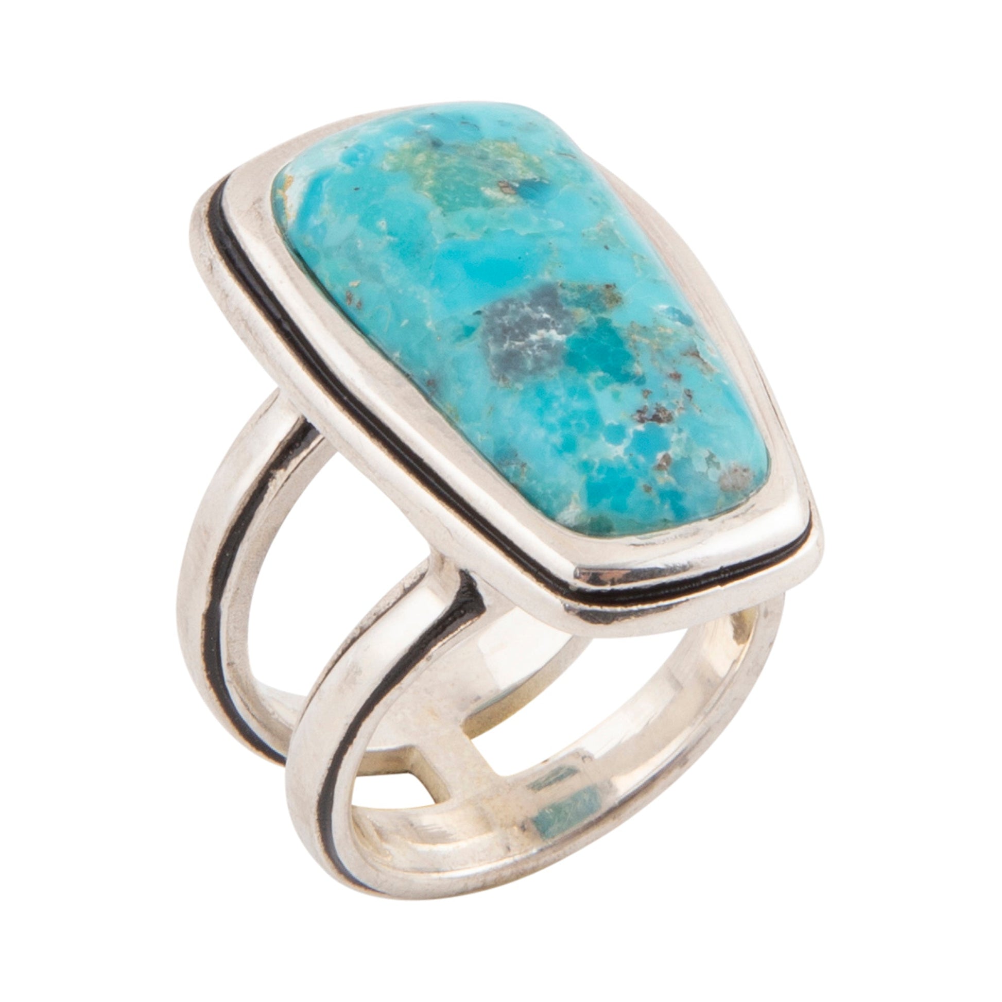 Silver ring with a turquoise stone on a white background