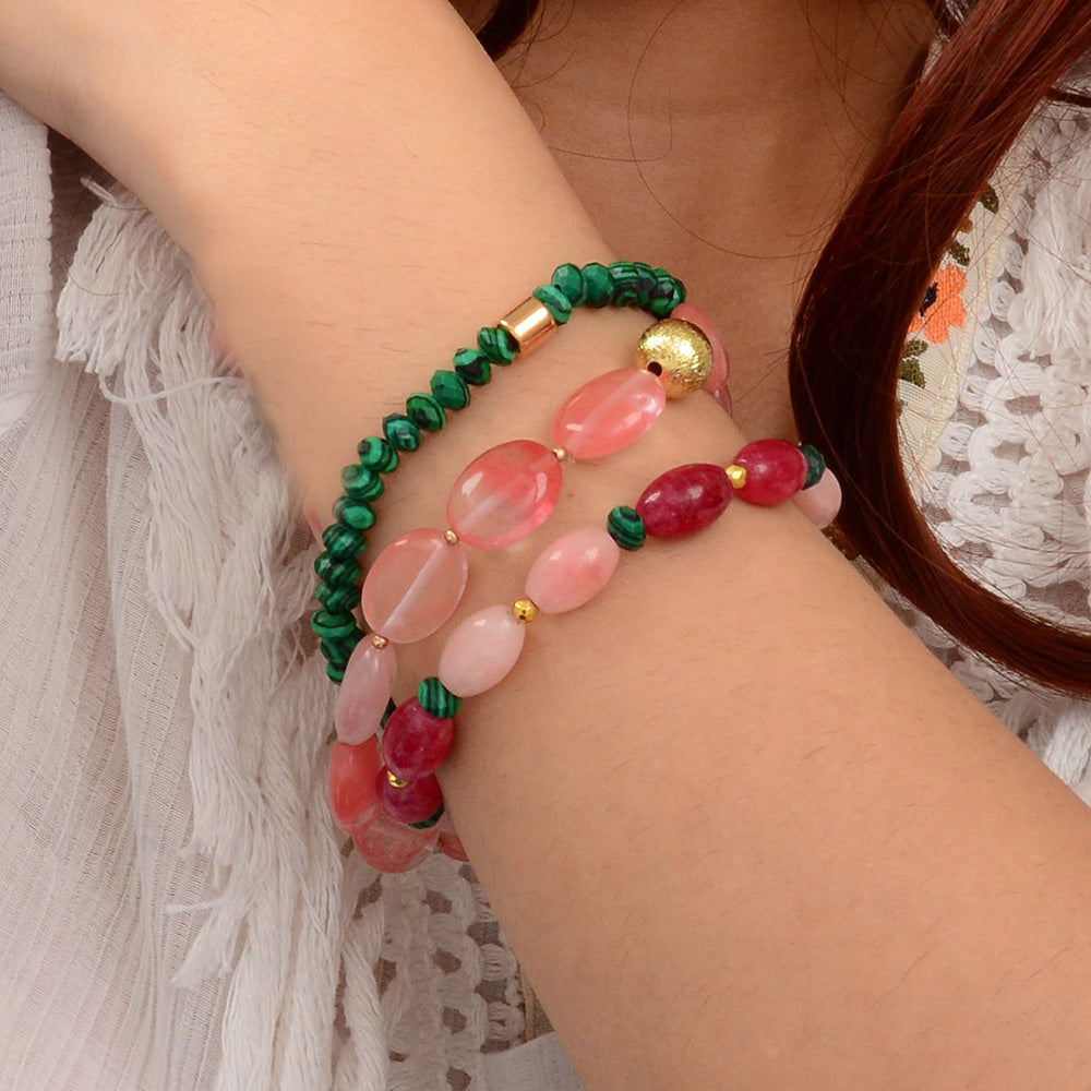 Colorful beaded bracelet on a wrist with a blurred background