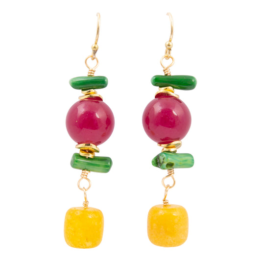Pair of earrings with pink and yellow beads on a white background