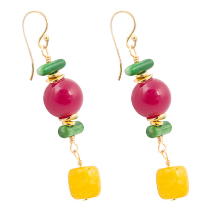 Pair of earrings with pink and yellow beads on a white background