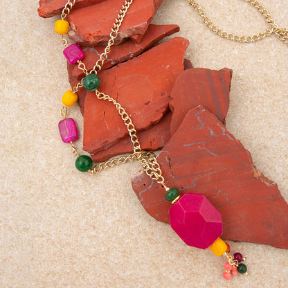Necklace with colorful beads on a textured surface