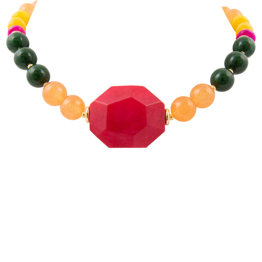 Colorful beaded necklace with a large red bead on a white background