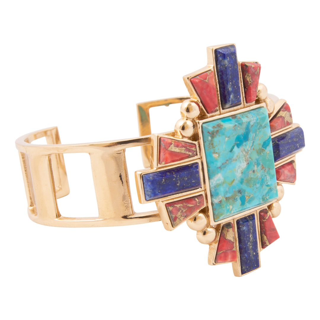 Multicolored gemstone bracelet with gold accents on a white background