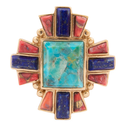 Gold ring with turquoise, red, and blue stones on a white background