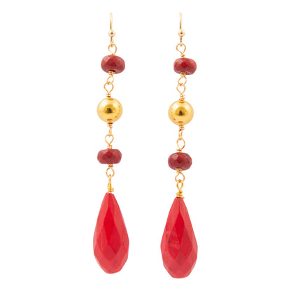A pair of gold and red drop earrings featuring faceted red beads, polished gold beads, and large teardrop-shaped red pendants, shown against a plain white background.