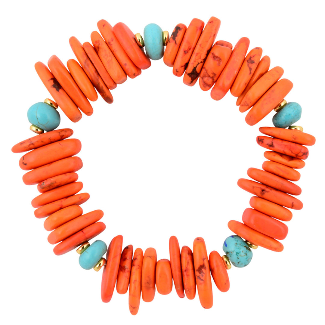 Necklace with orange beads and turquoise accents on a white background