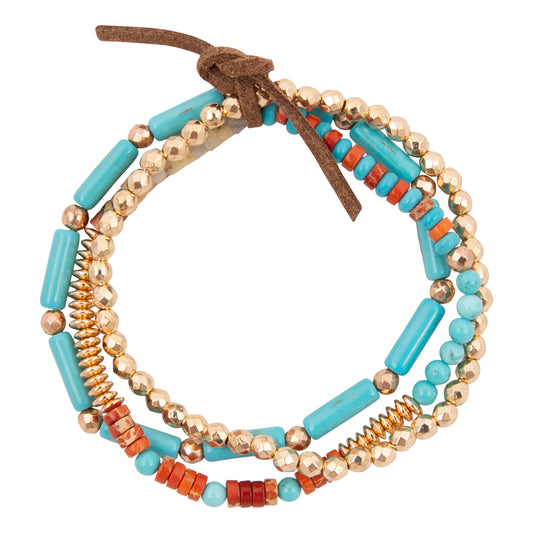 Multicolored beaded bracelet with turquoise, gold, and red beads on a white background