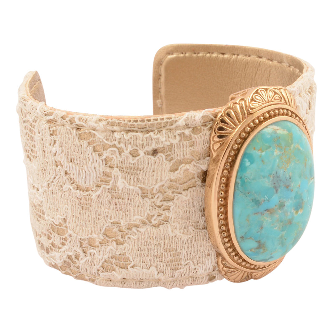Lace bracelet with turquoise stone and gold accents on a white background