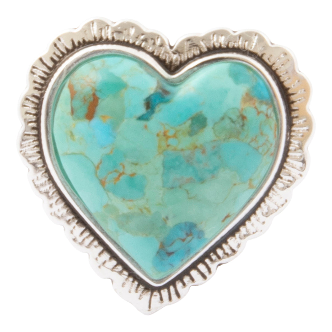 A heart-shaped turquoise stone ring with a textured sterling silver frame, shown on a plain white background.