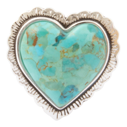 A heart-shaped turquoise stone ring with a textured sterling silver frame, shown on a plain white background.