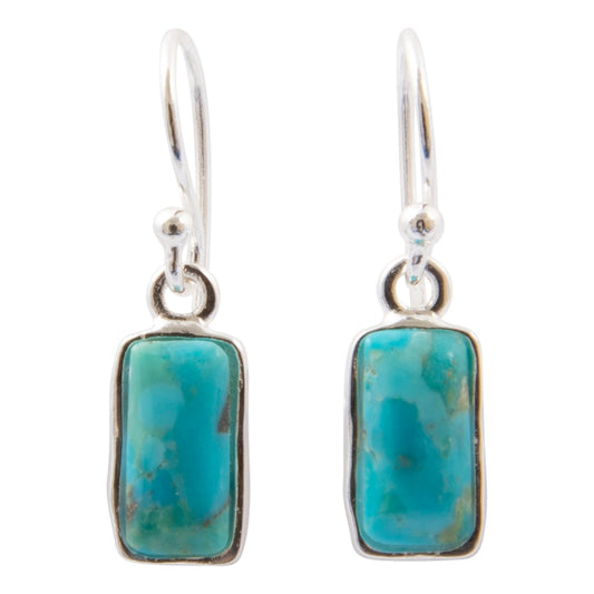 A pair of silver drop earrings featuring rectangular turquoise cabochon stones in silver bezel settings, suspended from silver fishhook wires on a plain white background.