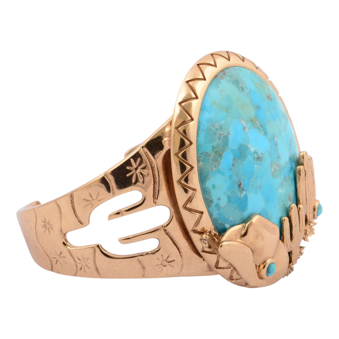 Rose gold ring with a large turquoise stone on a white background