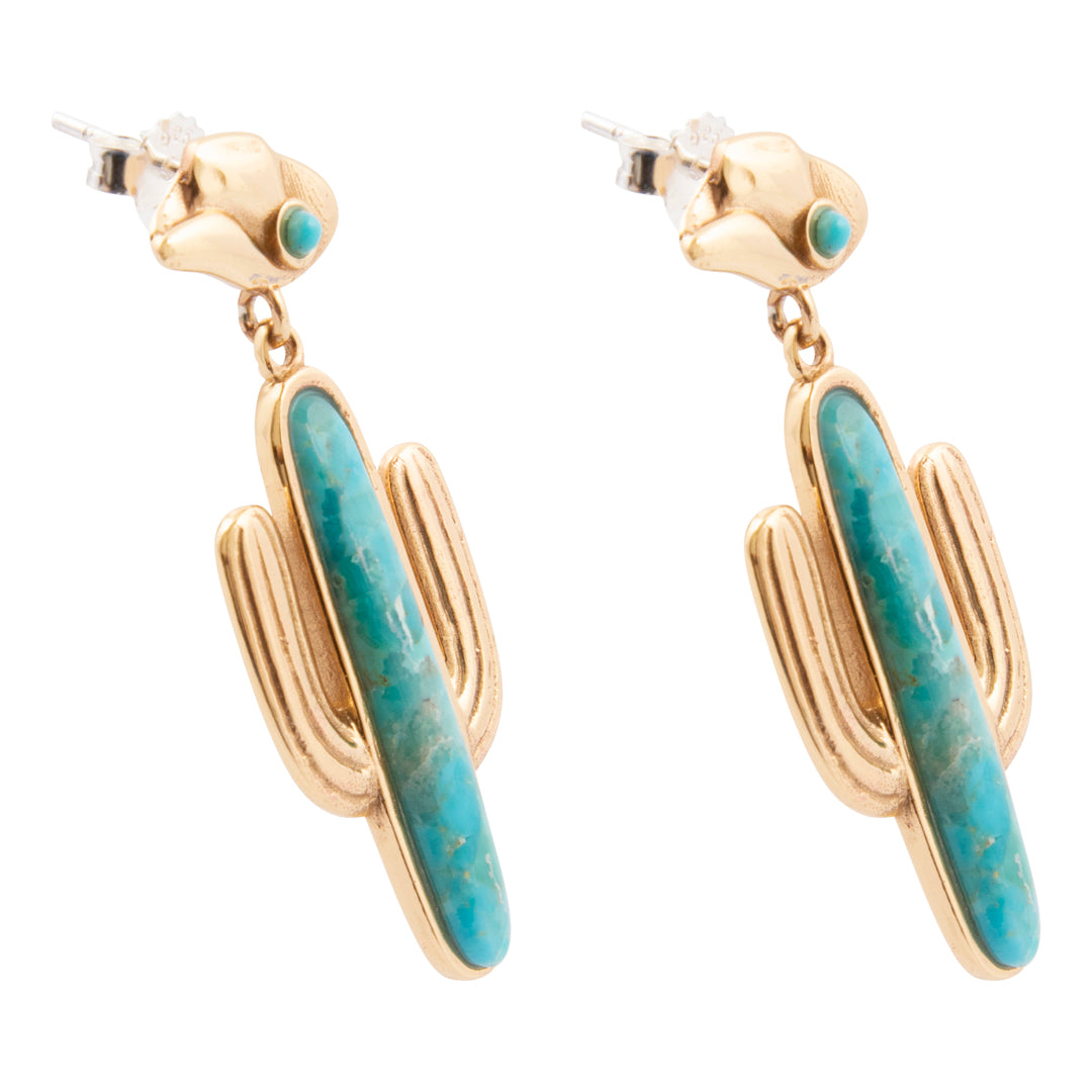 Gold and turquoise cactus-shaped earrings on a white background