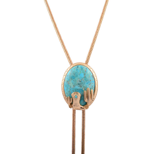 Necklace with a turquoise stone and gold accents on a white background