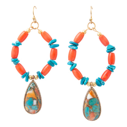 A pair of bohemian dangle earrings featuring coral and turquoise beads with teardrop-shaped turquoise stone pendants, shown on a solid white background.