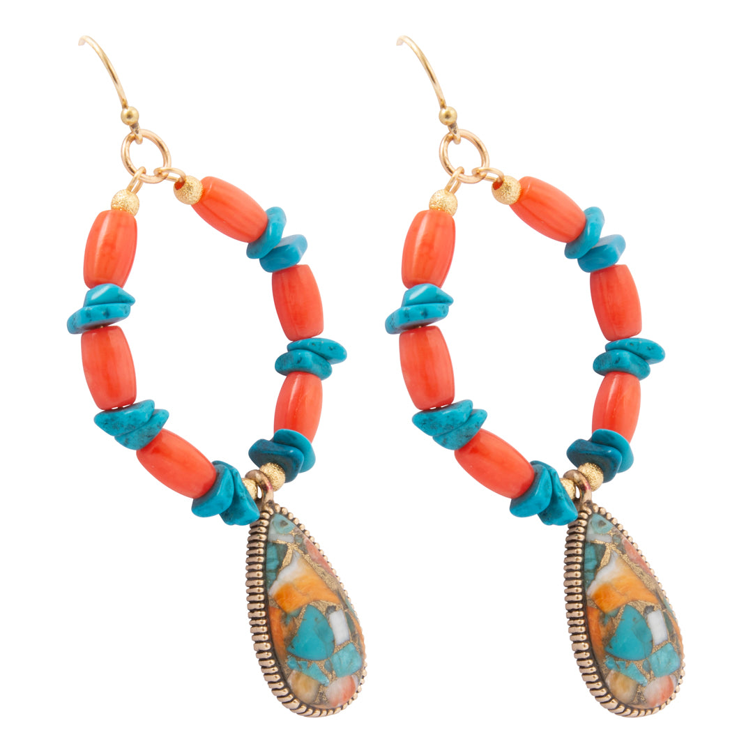 A pair of bohemian dangle earrings featuring coral beads, turquoise spacers, gold-tone hooks, and teardrop-shaped turquoise and gold charms, shown on a solid white background.
