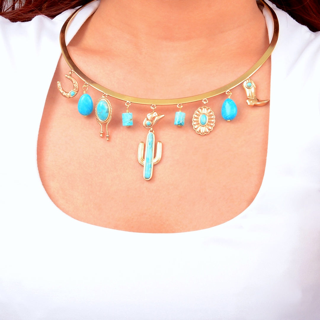 Necklace with blue stones and cactus charm on a white background
