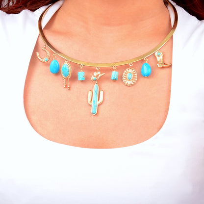 Necklace with blue stones and cactus charm on a white background