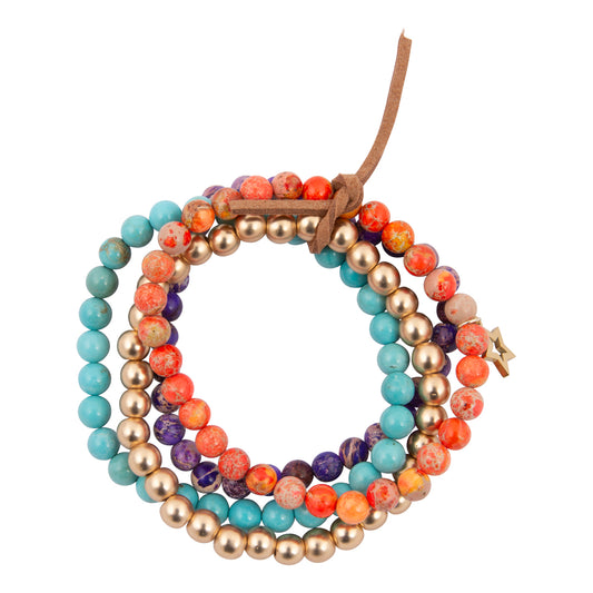 Stack of colorful beaded bracelets on a white background