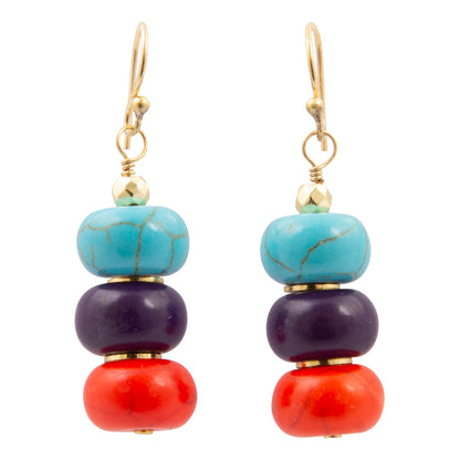 Colorful beaded earrings with gold accents on a white background