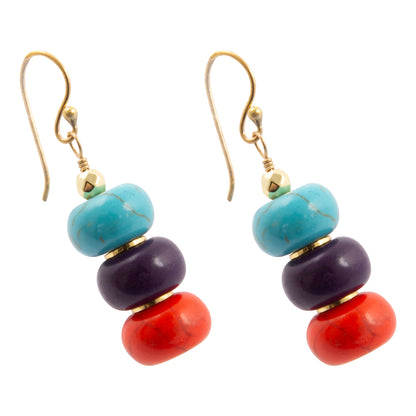 Colorful beaded earrings with gold hooks on a white background