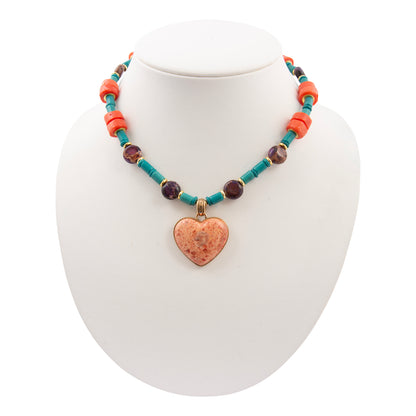Necklace with a heart pendant on a mannequin bust against a white background