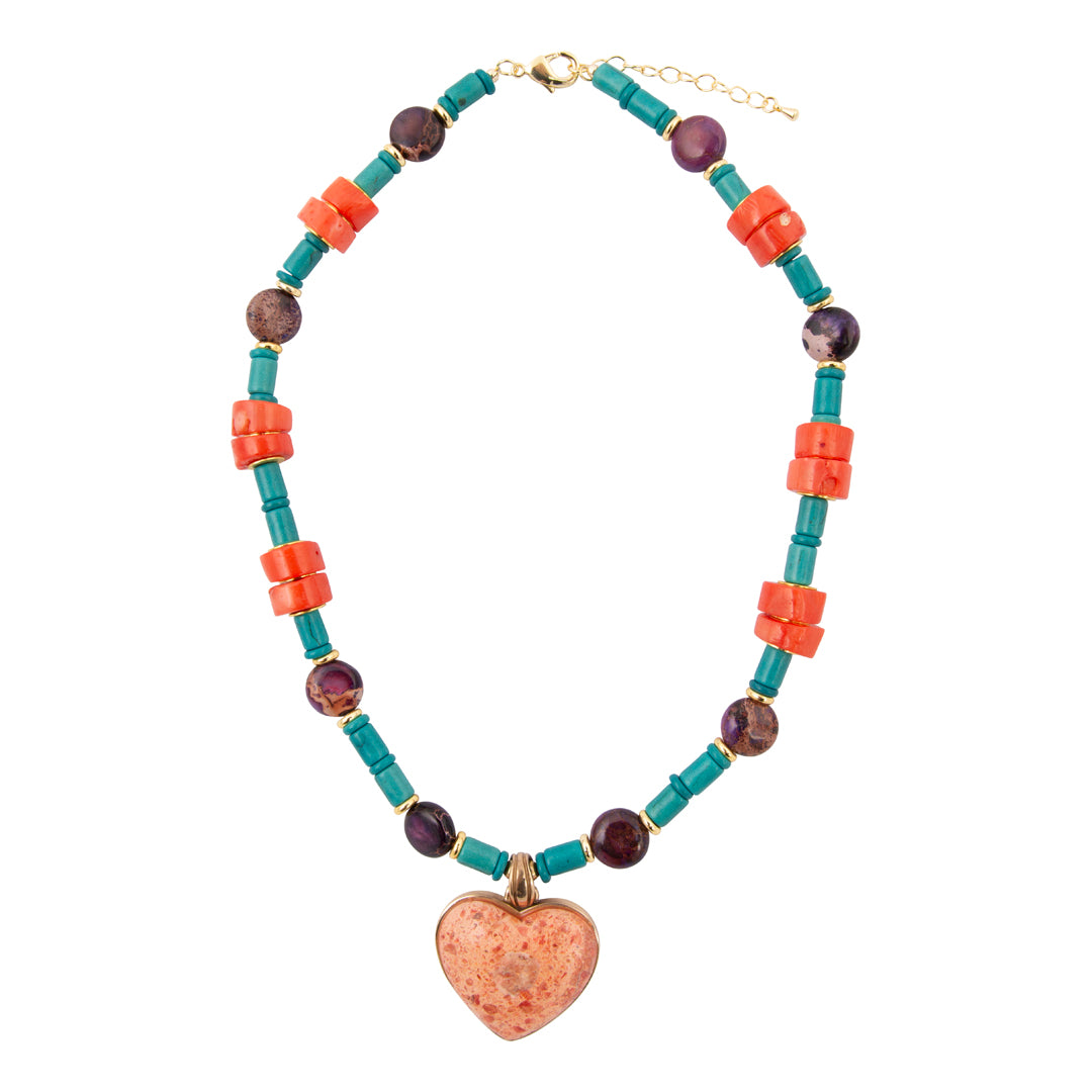 Necklace with colorful beads and a heart-shaped pendant on a white background