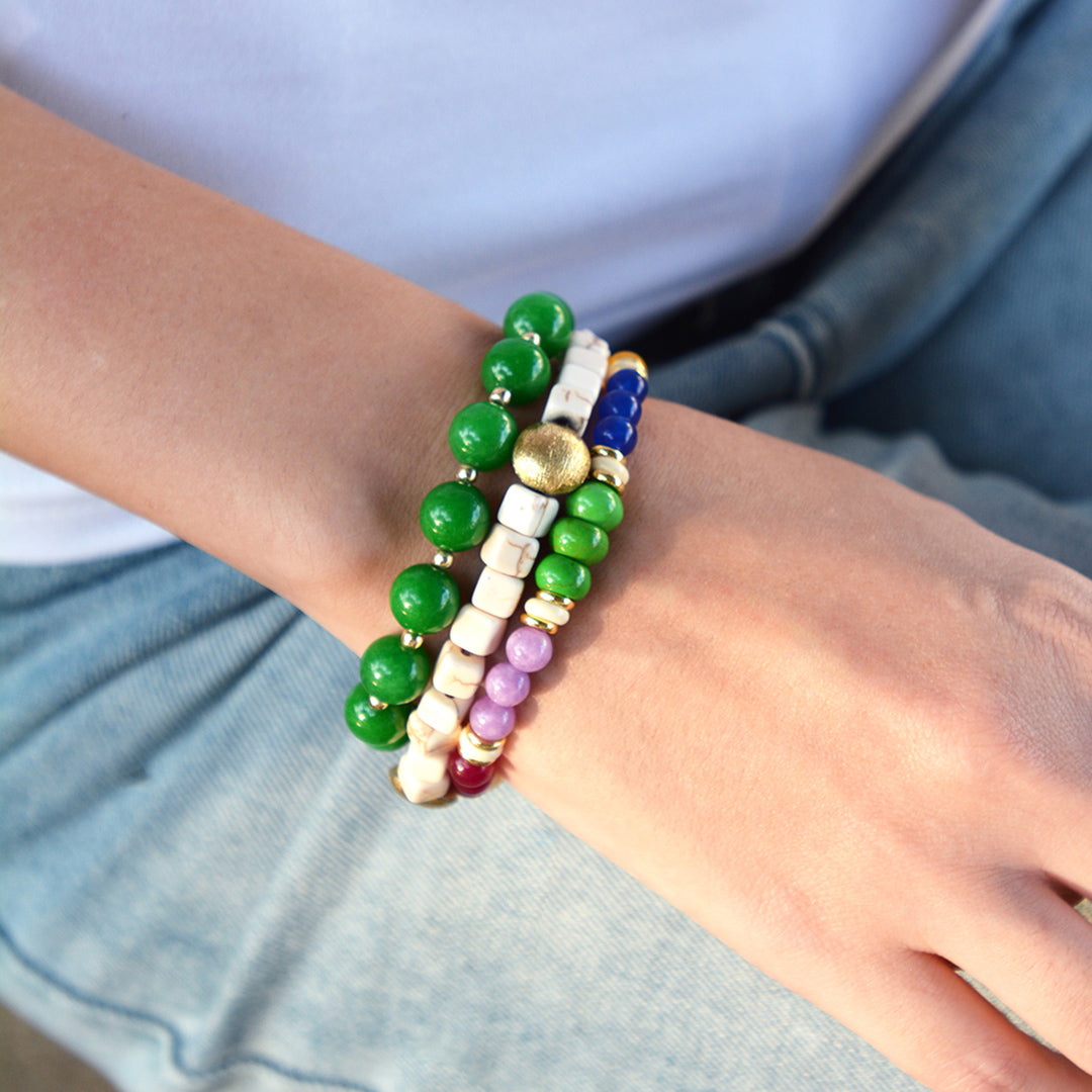 Colorful beaded bracelet on a wrist with a blurred background