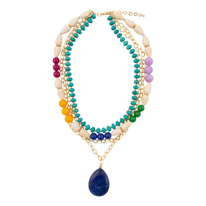 Multistrand necklace with colorful beads and a blue pendant on a white background